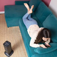 Black ceramic tower heater with digital display for efficient home heating