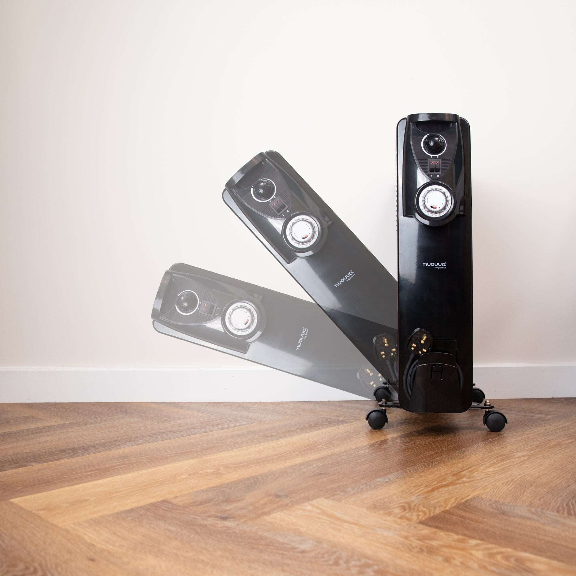 Nuovva black radiator heater with adjustable thermostat and controls.