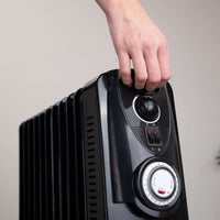 Black portable radiator with handle and adjustable controls.