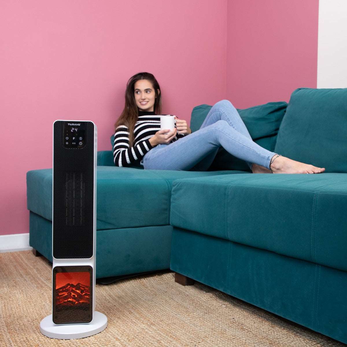 White ceramic tower heater with fireplace display for cozy home heating