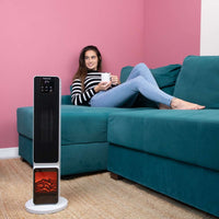White ceramic tower heater with fireplace display for cozy home heating