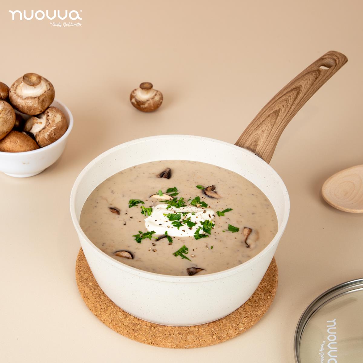 Cream ceramic saucepan with lid for stewing and cooking. 