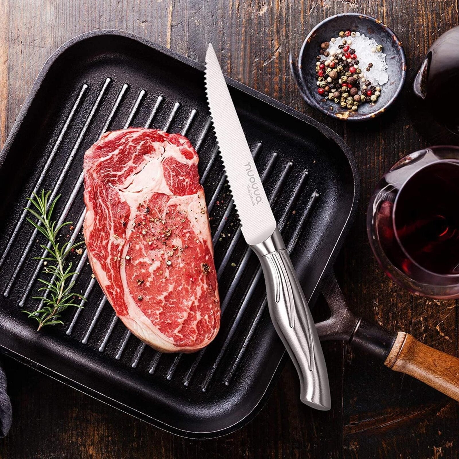 Nuovva stainless steel knife with serrated edge for easy meat cutting.