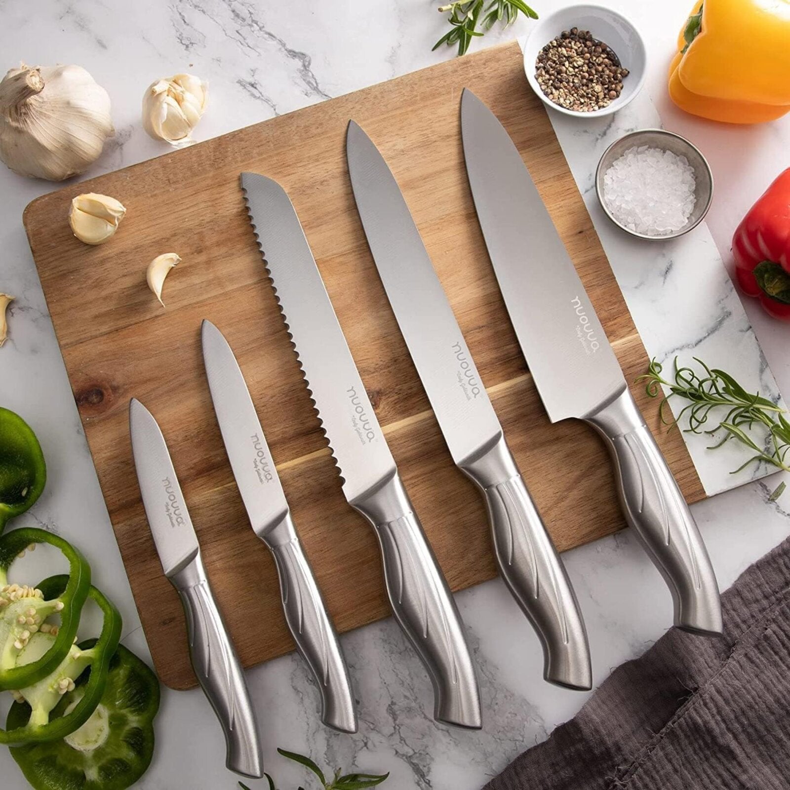 5pcs nuovva stainless steel knife set includes a chefs knife, bread knife, slicing knife, paring knife and utility knife. 