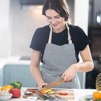 Woman using Nuovva stainless steel kitchen knife 