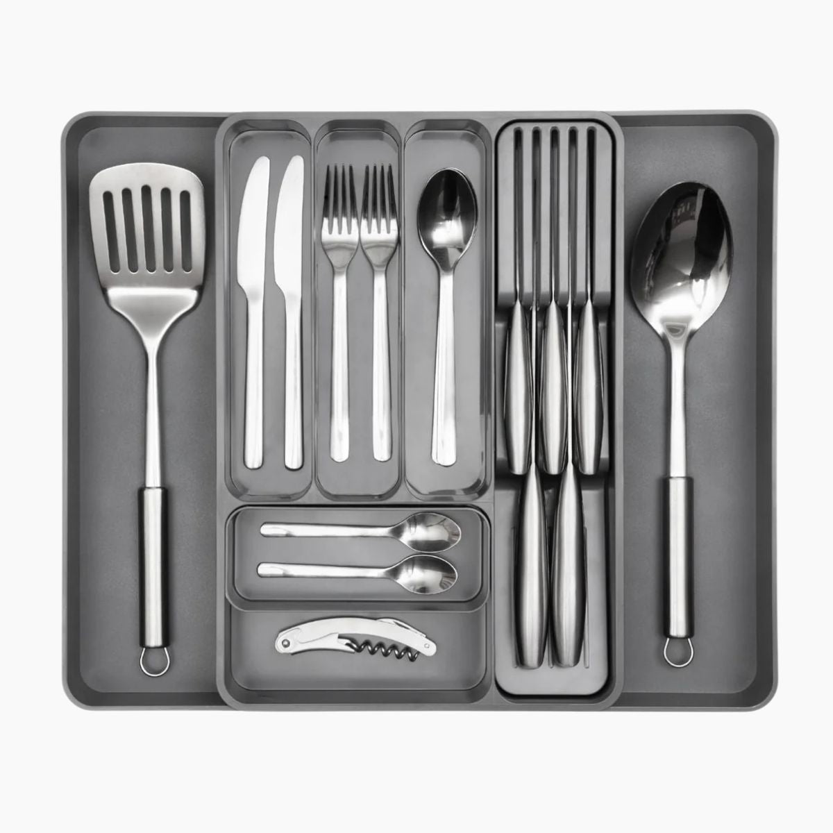 Grey adjustable cutlery drawers with slotted knife section for easy kitchen organization. 