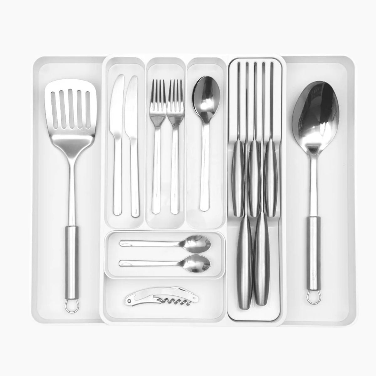 White extendable cutlery drawer organizer with adjustable sides and additional slots for home organization. 
