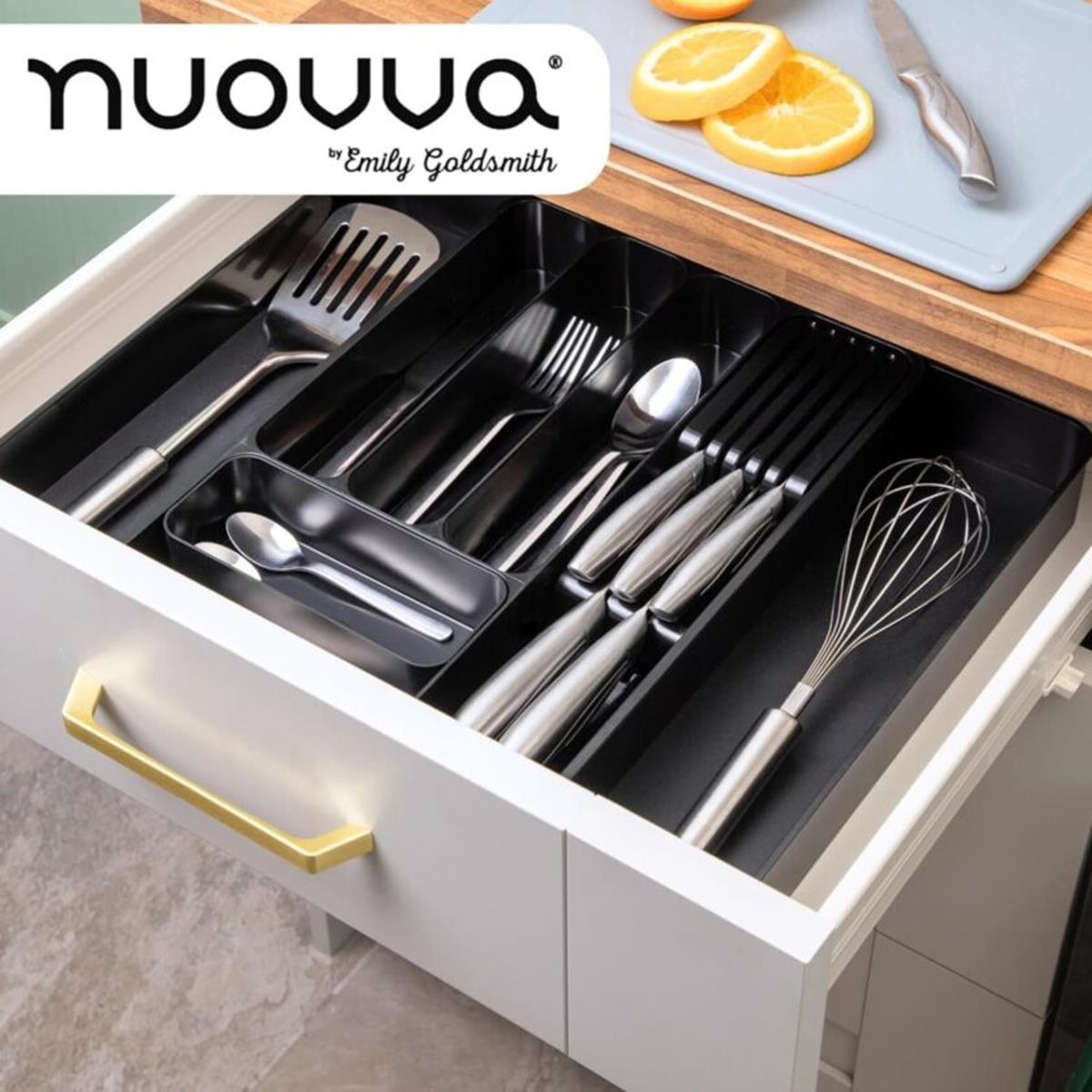 Open kitchen drawer displaying the black cutlery organizer for drawers