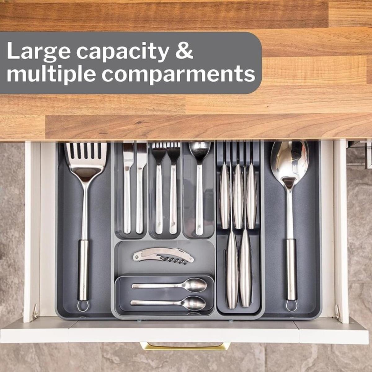 Grey cutlery organizer in a drawer with large capacity and multiple compartments for organized homes.