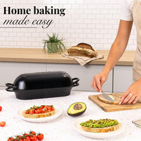 Black cast iron loaf pan, non-stick Dutch oven for easy home baking. 