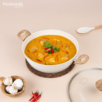 nuovva cream ceramic casserole pot with glass lid and silicone utensil for home cooking. 