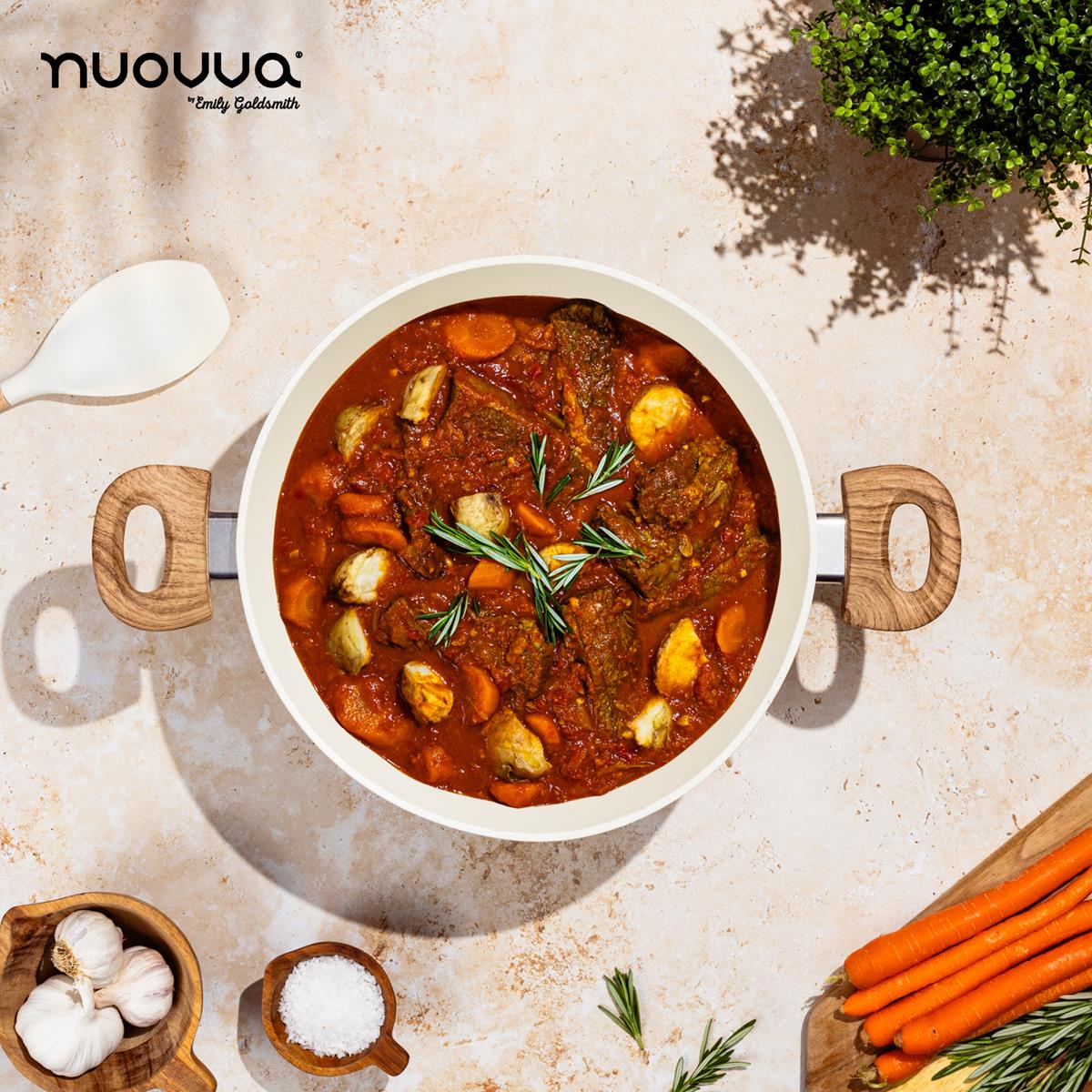 nuovva cream stockpot with wooden handles and cream utensil for easy home cooking.