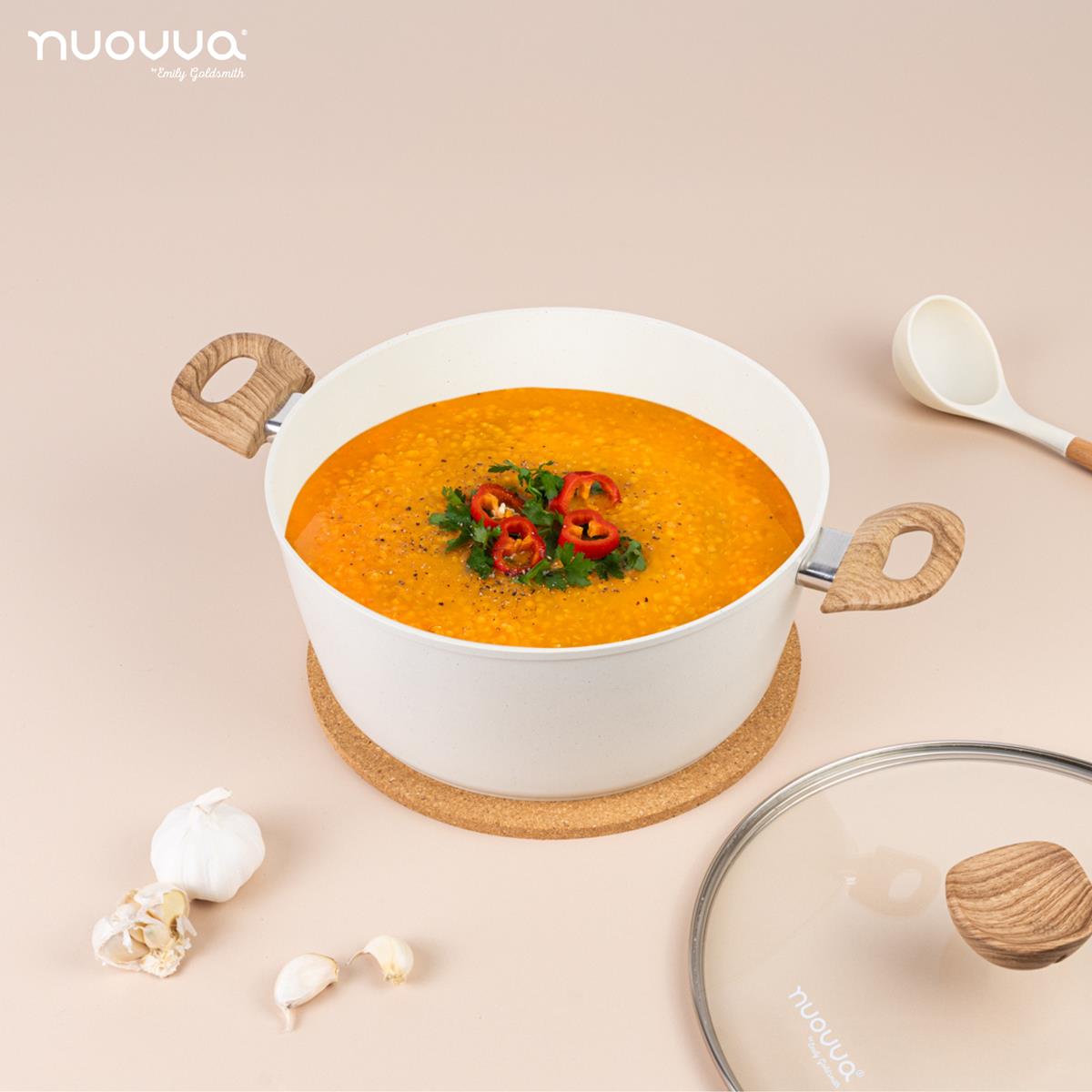 nuovva cream stockpot with glass lid, wooden handles and cream utensils for easy cooking. 