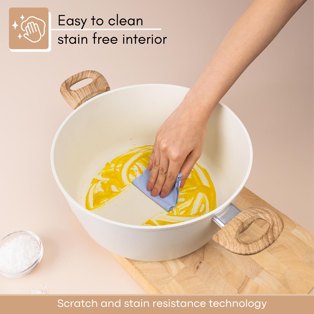 Easy to clean cream stockpot with stain free interior and scratch resistant technology