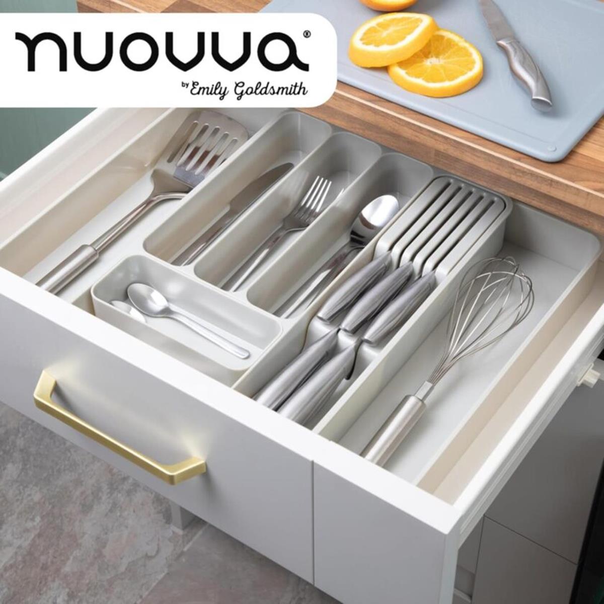 Kitchen drawer cutlery organizer with silverware and slotted knife partitions and more.