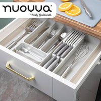 Kitchen drawer cutlery organizer with silverware and slotted knife partitions and more.
