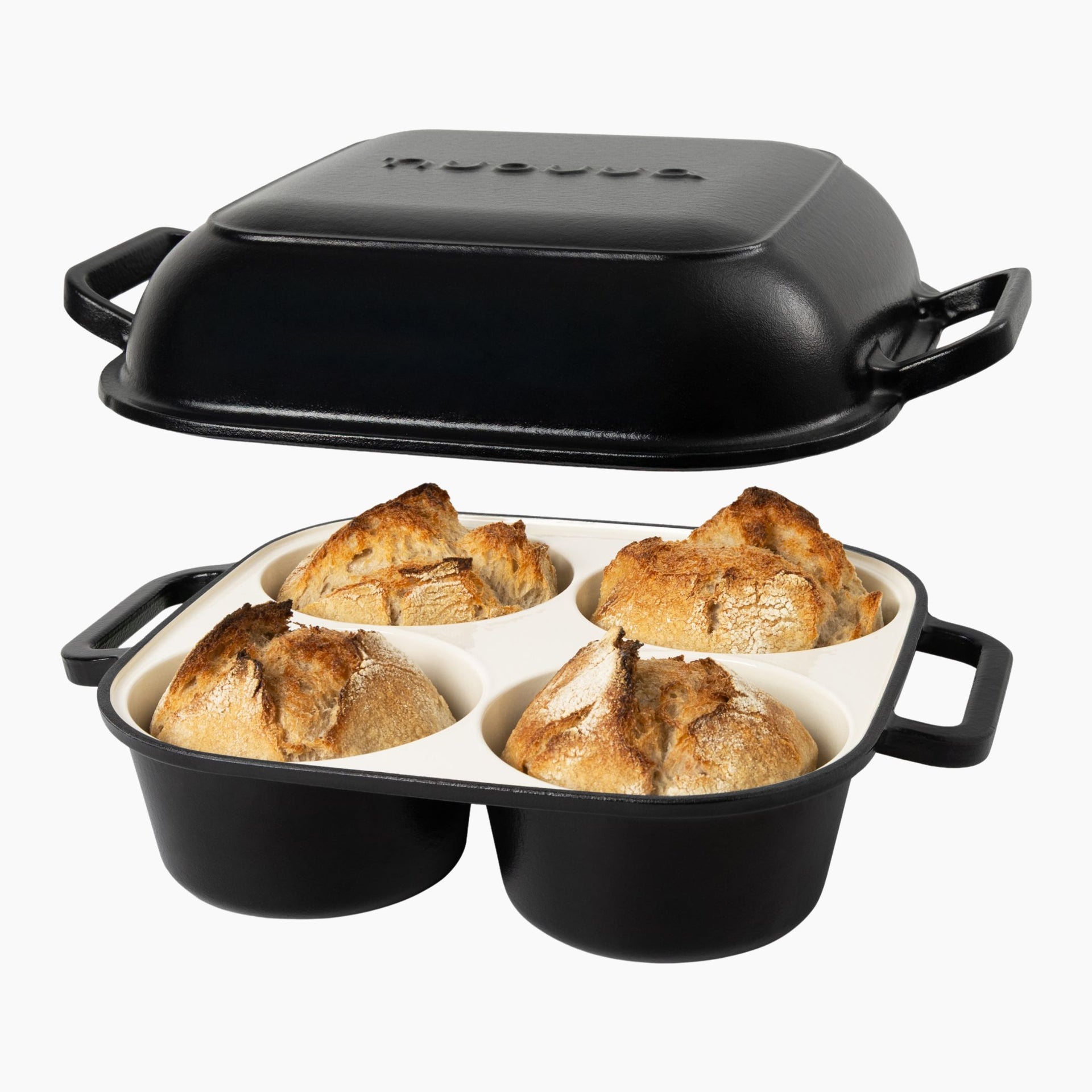 Black oven safe cast iron bread pan with 4 compartments for homemade bread.
