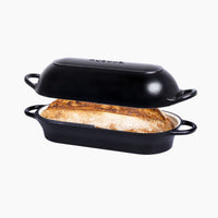 Black enamelled cast iron bread loaf pan with lid for bread baking. 