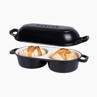 Nuovva black cast iron bread loaf pan with 2 compartments for home baking. 