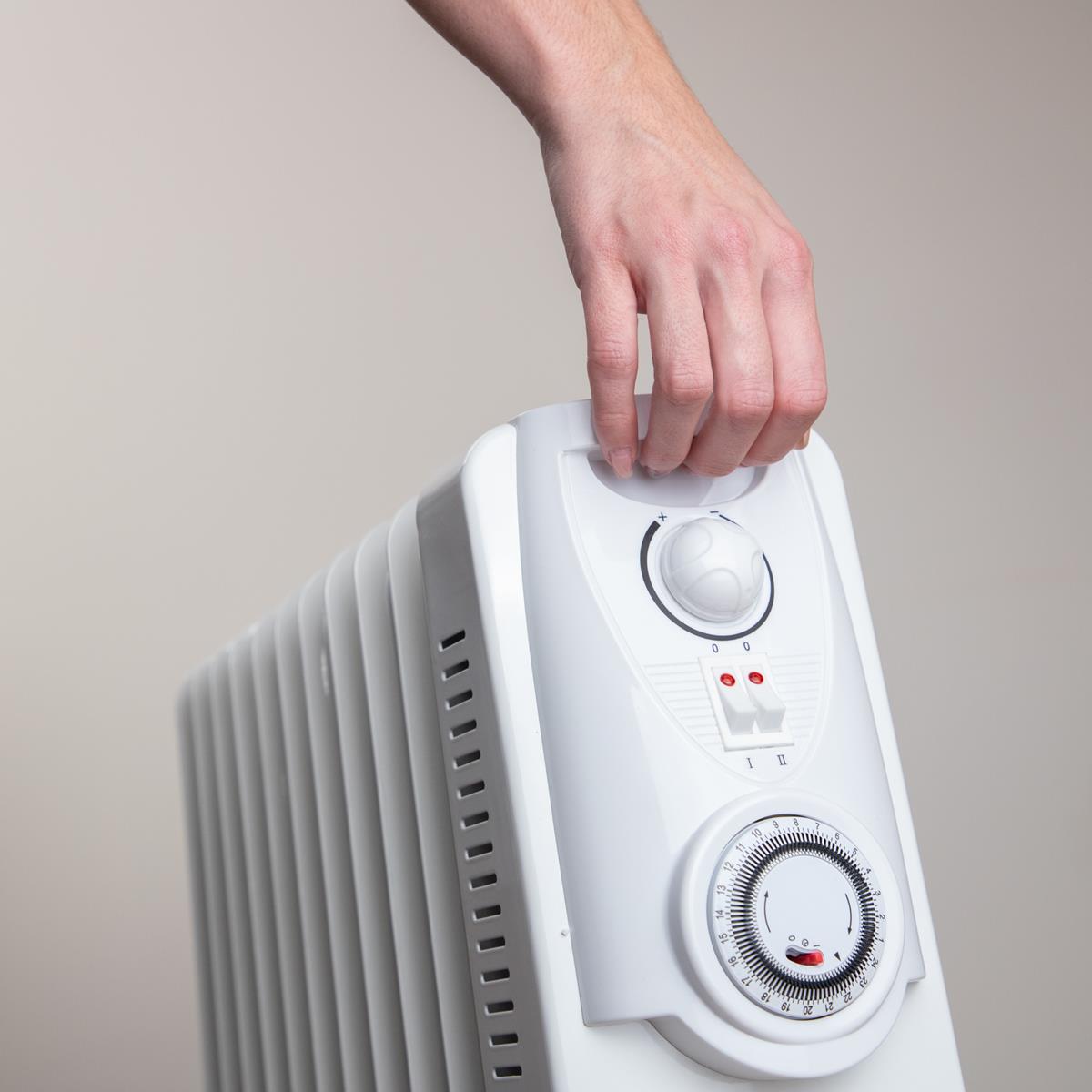 Portable radiator heater with handle for portability and home heating 