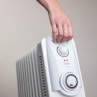 Portable radiator heater with handle for portability and home heating 