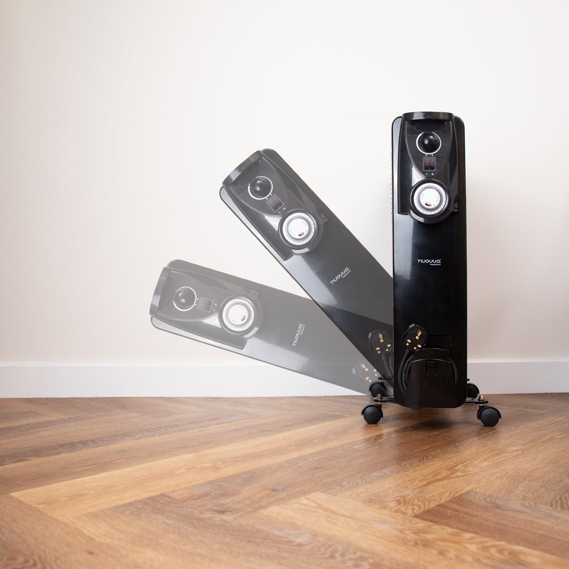 Nuovva black radiator heater with adjustable thermostat and controls. 