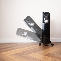 Nuovva black radiator heater with adjustable thermostat and controls. 