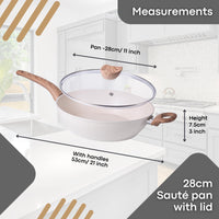 28cm cream granite sauté pan with lid on a kitchen counter with measurements displayed.