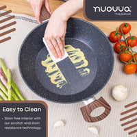 Person cleaning a non-stick easy to clean sauté pan with scratch and stain resistant technology