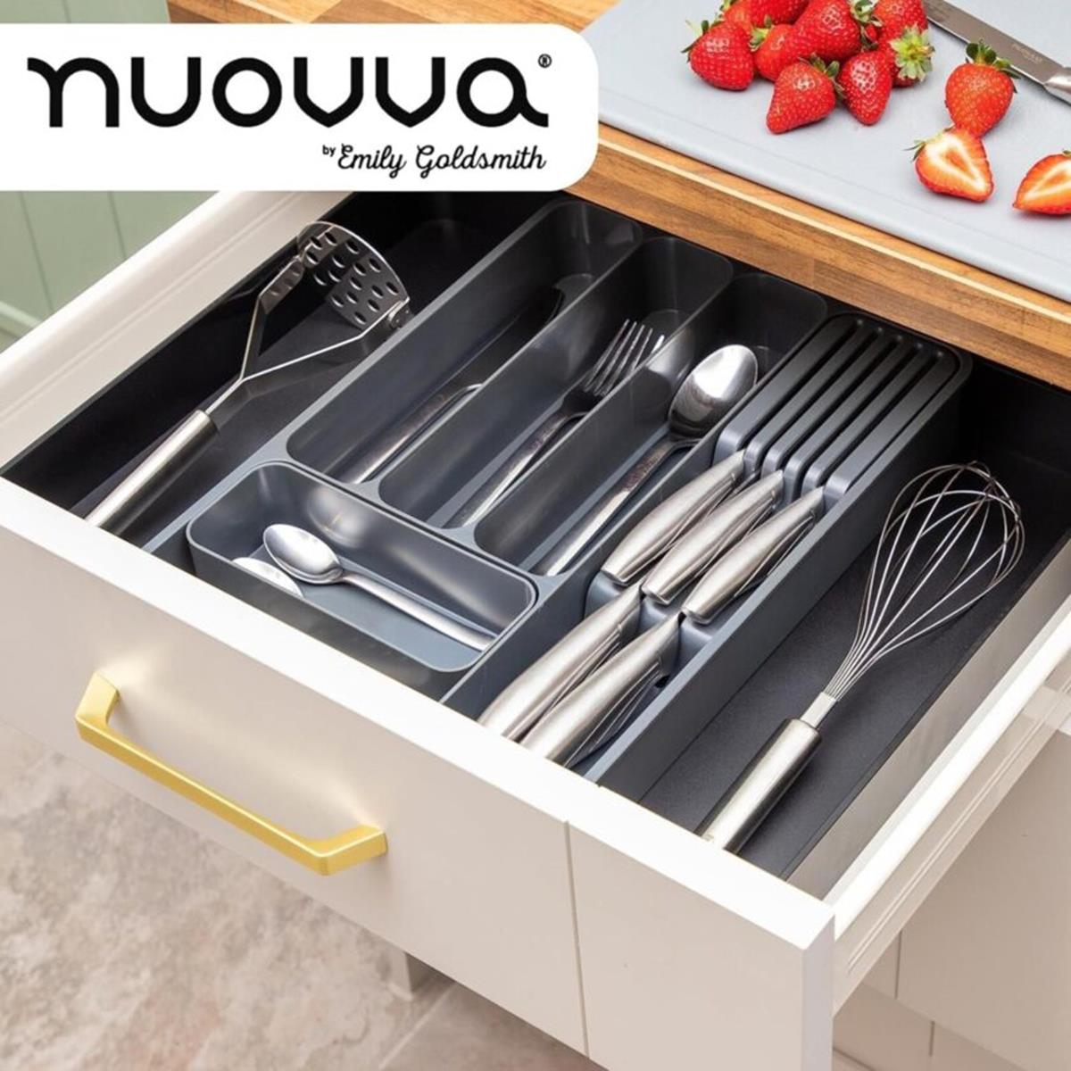 Adjustable Cutlery organizer in a kitchen drawer with utensils 