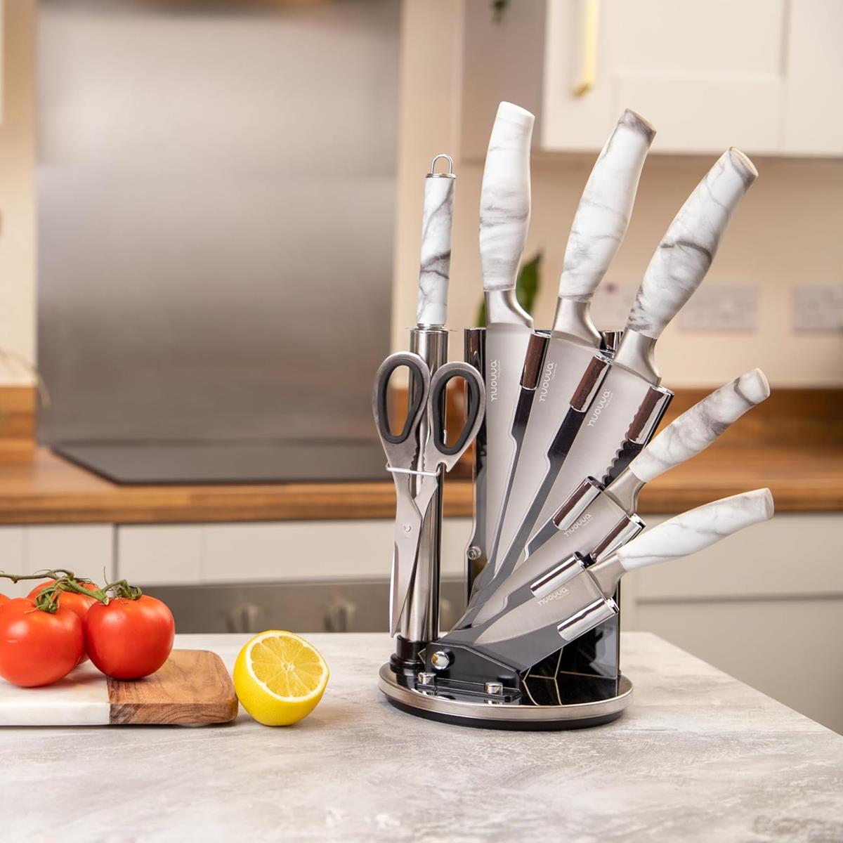 Stainless steel kitchen knife set with rotating block includes knife sharpener, slicing knife, chefs knife and more. 