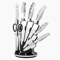 Set of kitchen knives with marble effect handle and 360 rotating block for easy access. 