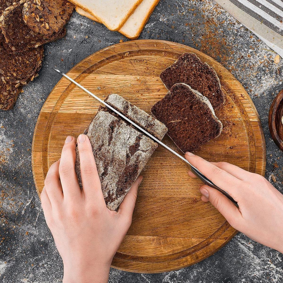 Stainless steel kitchen bread knife with serrated blade. 